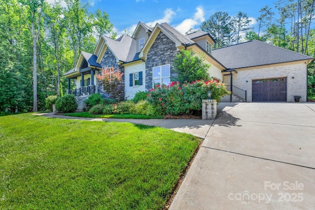 2122 Goose Creek Farm Ln, Indian Trail, NC 28079 - craftsman inspired home featuring concrete driveway, stone siding, an attached garage, a front yard, and a shingled roof