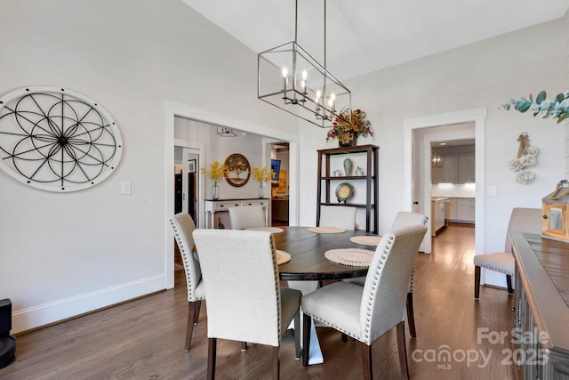 2122 Goose Creek Farm Ln, Indian Trail, NC 28079 - dining area featuring wood finished floors, a chandelier, and high vaulted ceiling