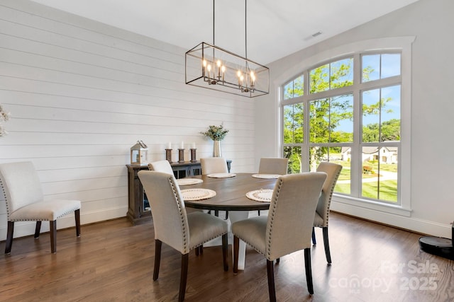 2122 Goose Creek Farm Ln, Indian Trail, NC 28079 - dining area featuring a chandelier, dark wood-style flooring, and wooden walls