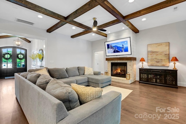 2122 Goose Creek Farm Ln, Indian Trail, NC 28079 - living area featuring beam ceiling, wood finished floors, a brick fireplace, coffered ceiling, and recessed lighting