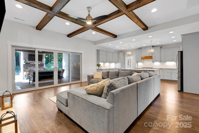 2122 Goose Creek Farm Ln, Indian Trail, NC 28079 - living area with coffered ceiling, beamed ceiling, wood finished floors, recessed lighting, and ceiling fan