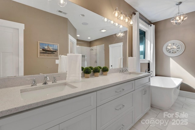 2122 Goose Creek Farm Ln, Indian Trail, NC 28079 - full bath featuring a stall shower, double vanity, and a freestanding tub