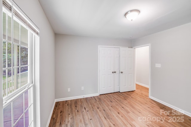 9000 Vagabond Rd, Charlotte, NC 28227 - unfurnished bedroom featuring light wood-style flooring and a closet