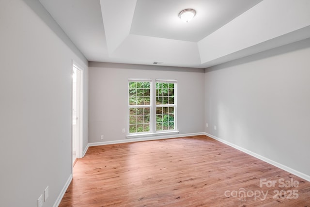 9000 Vagabond Rd, Charlotte, NC 28227 - unfurnished room featuring a raised ceiling and light wood finished floors