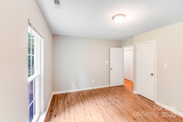 9000 Vagabond Rd, Charlotte, NC 28227 - unfurnished bedroom with light wood-style floors and baseboards