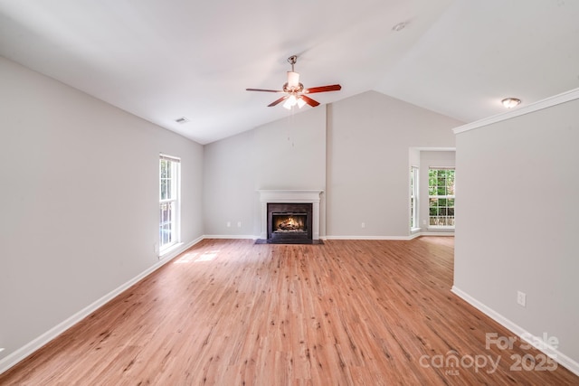 9000 Vagabond Rd, Charlotte, NC 28227 - unfurnished living room with lofted ceiling, wood finished floors, a fireplace with flush hearth, and a ceiling fan