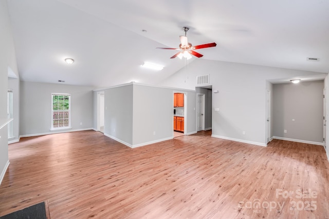 9000 Vagabond Rd, Charlotte, NC 28227 - unfurnished living room featuring light wood finished floors, a ceiling fan, and vaulted ceiling