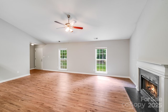 9000 Vagabond Rd, Charlotte, NC 28227 - unfurnished living room with a premium fireplace, ceiling fan, light wood-style floors, and vaulted ceiling