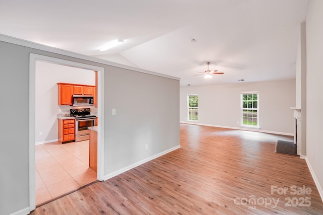 9000 Vagabond Rd, Charlotte, NC 28227 - unfurnished room with light wood finished floors, ceiling fan, and vaulted ceiling