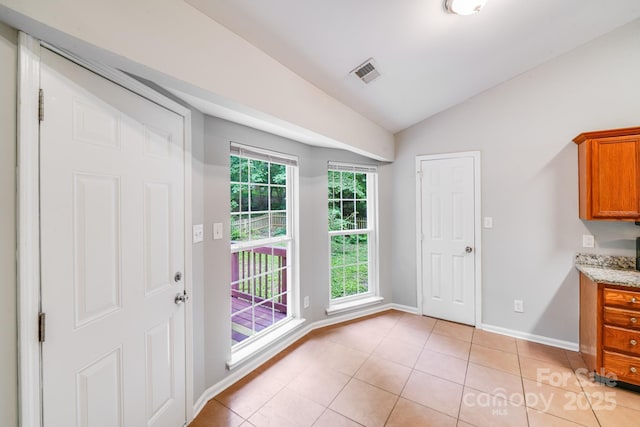 9000 Vagabond Rd, Charlotte, NC 28227 - entryway featuring vaulted ceiling and light tile patterned floors