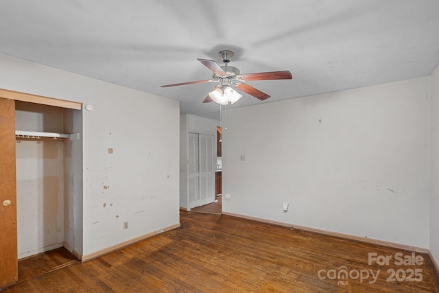 807 Claremont Rd, Charlotte, NC 28214 - unfurnished bedroom with multiple closets, wood finished floors, and a ceiling fan