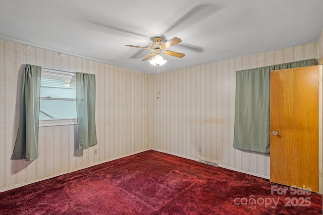 807 Claremont Rd, Charlotte, NC 28214 - carpeted spare room with ceiling fan and wallpapered walls