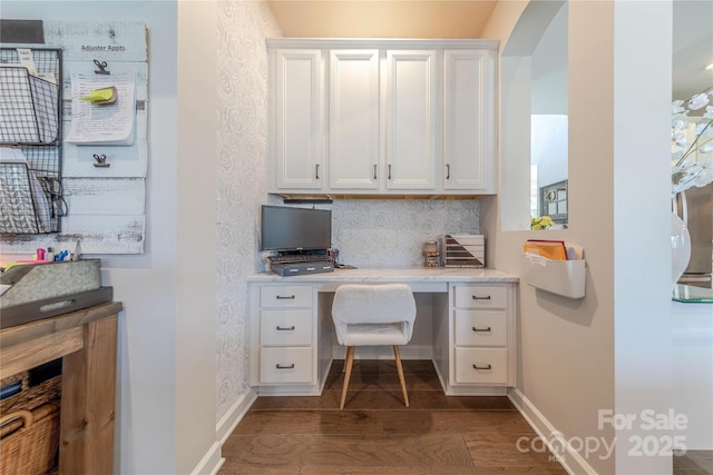 1178 Arges River Dr, Fort Mill, SC 29715 - home office with built in desk, dark wood-style floors, and arched walkways