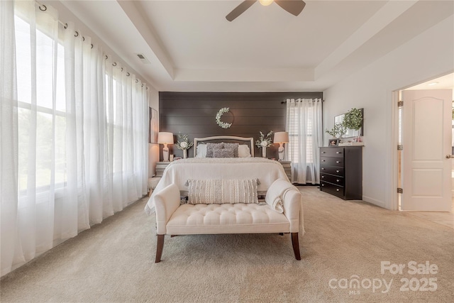 1178 Arges River Dr, Fort Mill, SC 29715 - bedroom featuring light carpet, a tray ceiling, and a ceiling fan