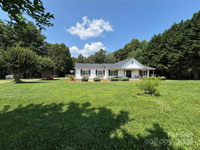 8122 Hutchison Ln, Vale, NC 28168 - ranch-style home with a porch and a front lawn