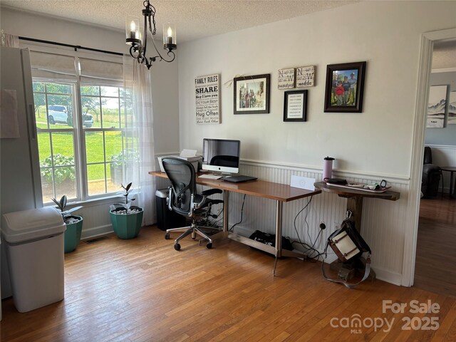 8122 Hutchison Ln, Vale, NC 28168 - office area with wainscoting, hardwood / wood-style flooring, a chandelier, and a textured ceiling