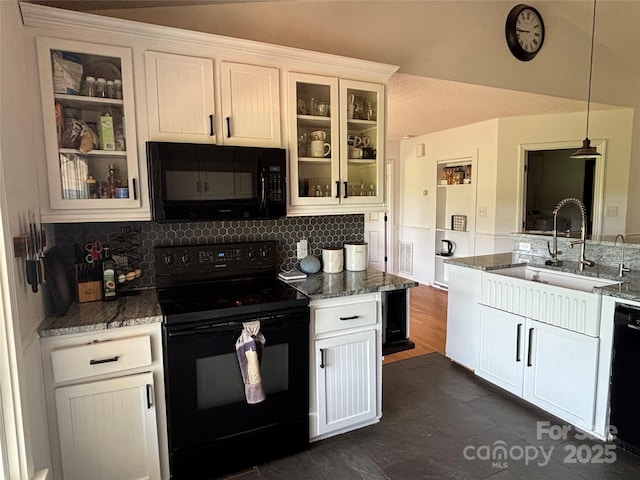 8122 Hutchison Ln, Vale, NC 28168 - kitchen featuring black appliances, decorative backsplash, decorative light fixtures, stone countertops, and glass insert cabinets