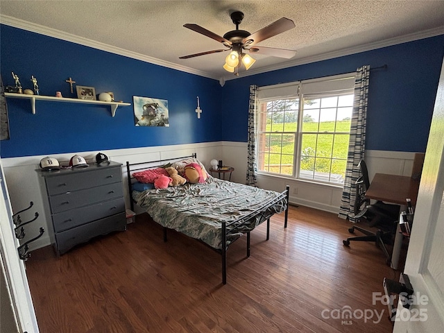 8122 Hutchison Ln, Vale, NC 28168 - bedroom with crown molding, a textured ceiling, a wainscoted wall, wood finished floors, and ceiling fan
