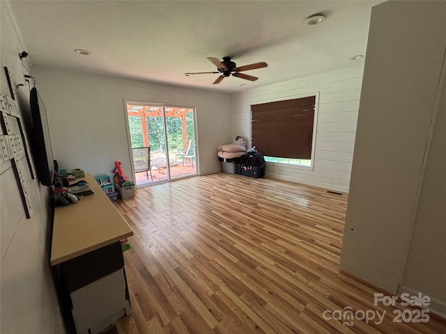 8122 Hutchison Ln, Vale, NC 28168 - unfurnished living room featuring wood finished floors and a ceiling fan