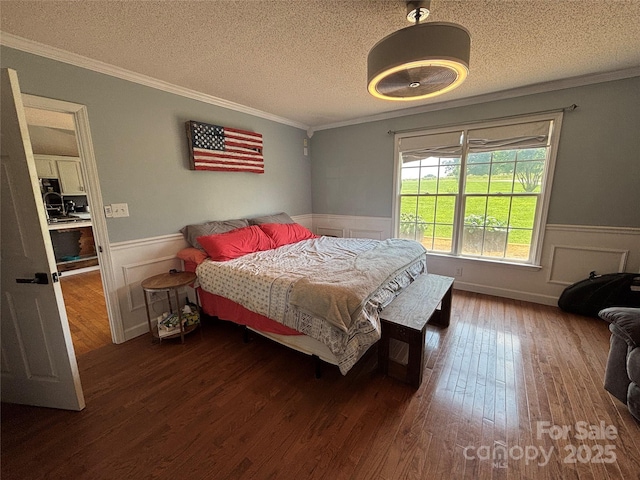 8122 Hutchison Ln, Vale, NC 28168 - bedroom with a wainscoted wall, wood finished floors, a textured ceiling, and ornamental molding