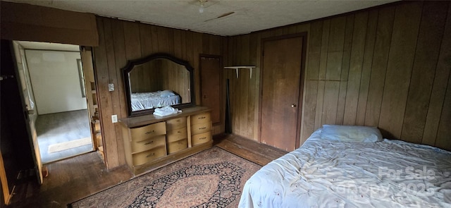 127 Hibriten Mountain Rd, Lenoir, NC 28645 - bedroom with wooden walls and wood finished floors