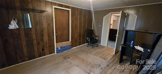 127 Hibriten Mountain Rd, Lenoir, NC 28645 - office with wooden walls, wood finished floors, a textured ceiling, and crown molding