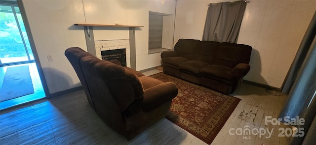 127 Hibriten Mountain Rd, Lenoir, NC 28645 - living area with wood-type flooring and a fireplace
