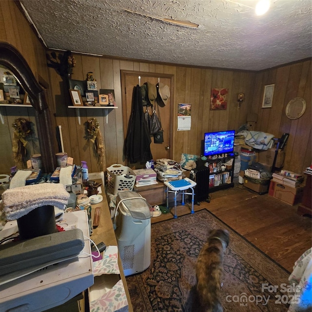 127 Hibriten Mountain Rd, Lenoir, NC 28645 - living area with wooden walls, a textured ceiling, and wood finished floors