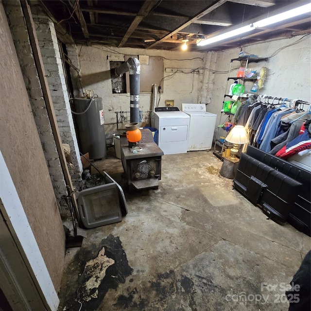 127 Hibriten Mountain Rd, Lenoir, NC 28645 - unfinished below grade area featuring electric water heater and separate washer and dryer