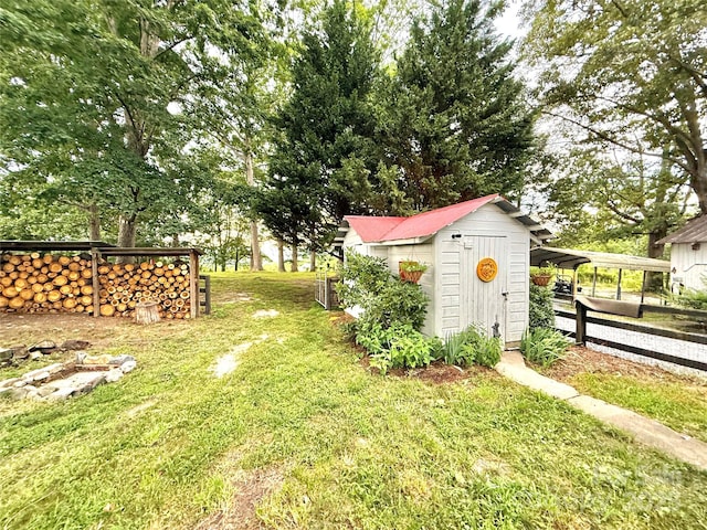 5188 Dysartsville Rd, Morganton, NC 28655 - view of yard with a storage shed and a carport