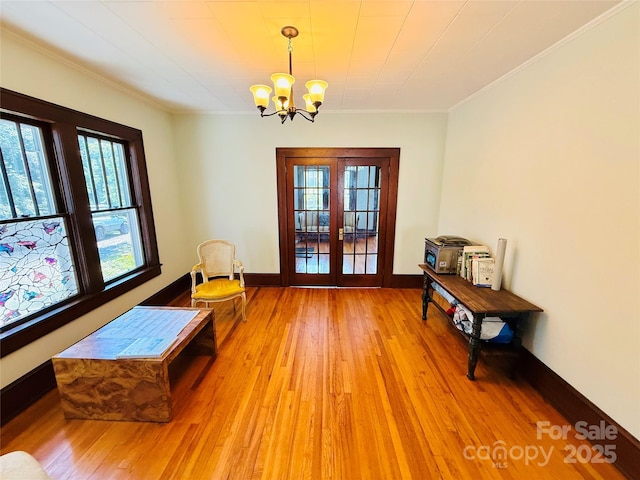 5188 Dysartsville Rd, Morganton, NC 28655 - sitting room with plenty of natural light, french doors, light wood-style flooring, a chandelier, and crown molding