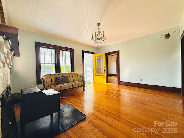 5188 Dysartsville Rd, Morganton, NC 28655 - living room with a chandelier, wood finished floors, and a fireplace