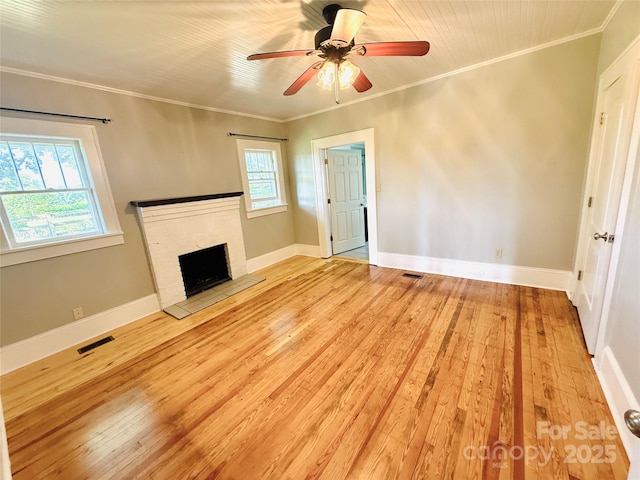 5188 Dysartsville Rd, Morganton, NC 28655 - unfurnished living room featuring wood-type flooring, ceiling fan, ornamental molding, and a fireplace with raised hearth