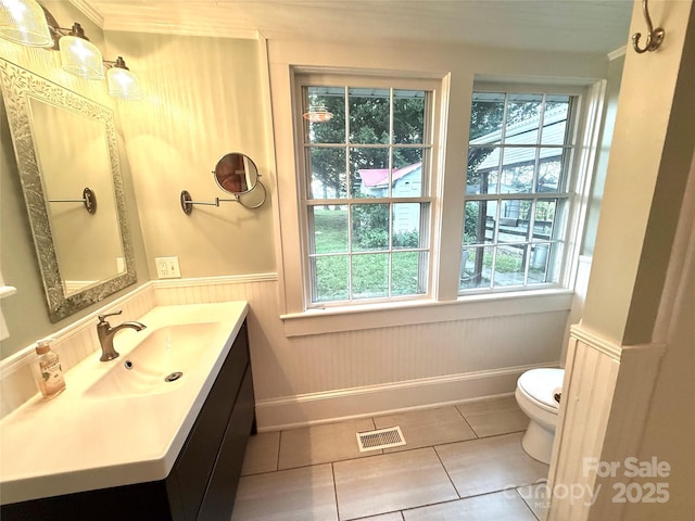 5188 Dysartsville Rd, Morganton, NC 28655 - bathroom with healthy amount of natural light, tile patterned floors, wainscoting, vanity, and crown molding