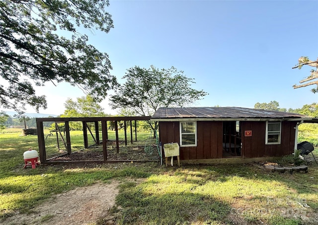 5188 Dysartsville Rd, Morganton, NC 28655 - view of home's exterior with an outbuilding, board and batten siding, exterior structure, and a yard