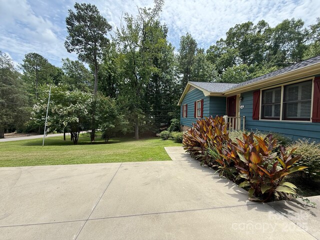 200 Breslin St, Wadesboro, NC 28170 - view of home's exterior with a lawn and a shingled roof