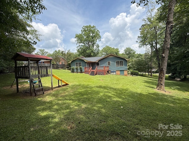 200 Breslin St, Wadesboro, NC 28170 - view of yard featuring a playground and a wooden deck