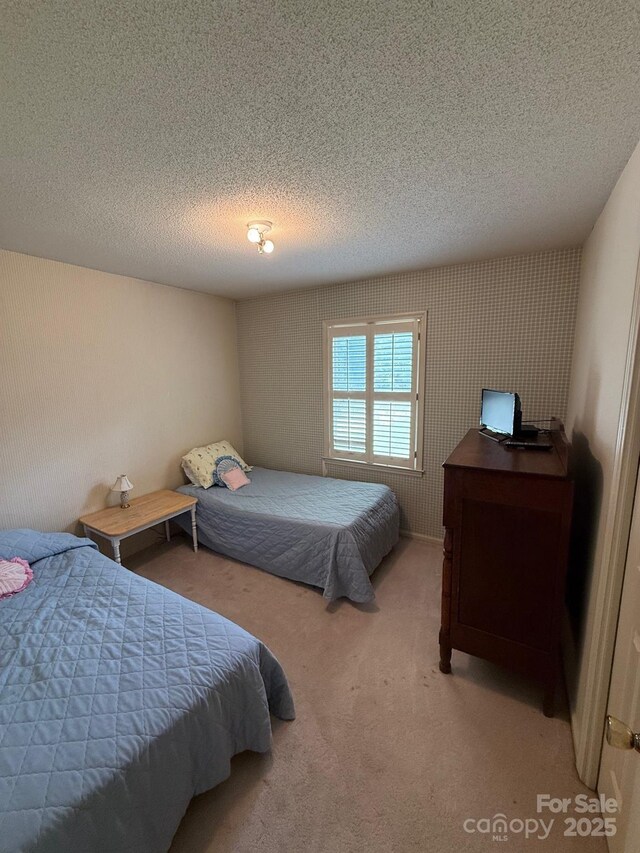 200 Breslin St, Wadesboro, NC 28170 - carpeted bedroom featuring a textured ceiling