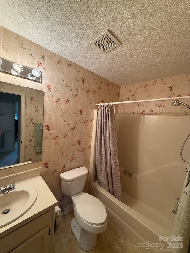200 Breslin St, Wadesboro, NC 28170 - bathroom featuring wallpapered walls, a textured ceiling, vanity, and shower / bathtub combination with curtain