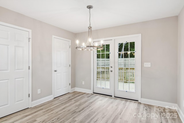 263 Robinson St, Rock Hill, SC 29730 - unfurnished dining area with a chandelier and wood finished floors
