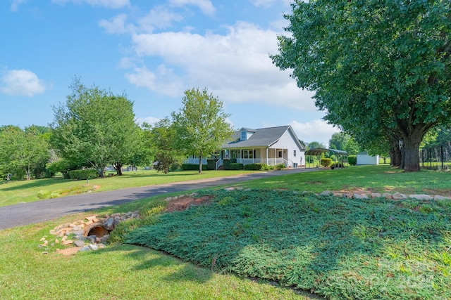 5211 Spring Gln, York, SC 29745 - view of grassy yard with asphalt driveway