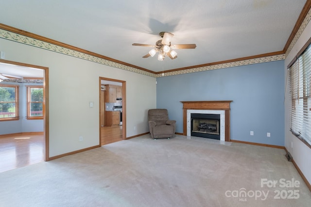 5211 Spring Gln, York, SC 29745 - unfurnished living room featuring ornamental molding, ceiling fan, carpet floors, and healthy amount of natural light