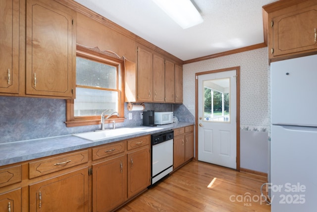5211 Spring Gln, York, SC 29745 - kitchen featuring white appliances, crown molding, wallpapered walls, decorative backsplash, and light wood-style flooring