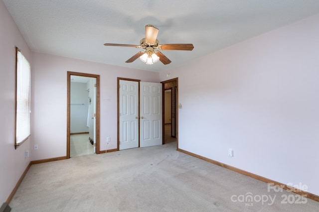 5211 Spring Gln, York, SC 29745 - unfurnished bedroom with light colored carpet, a closet, connected bathroom, and ceiling fan