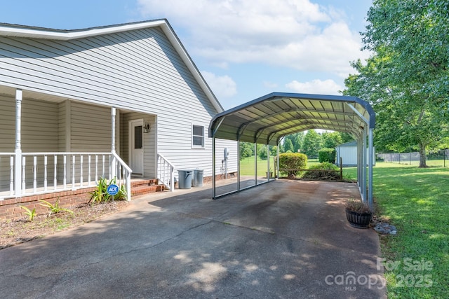 5211 Spring Gln, York, SC 29745 - view of parking / parking lot with a detached carport, driveway, and a shed