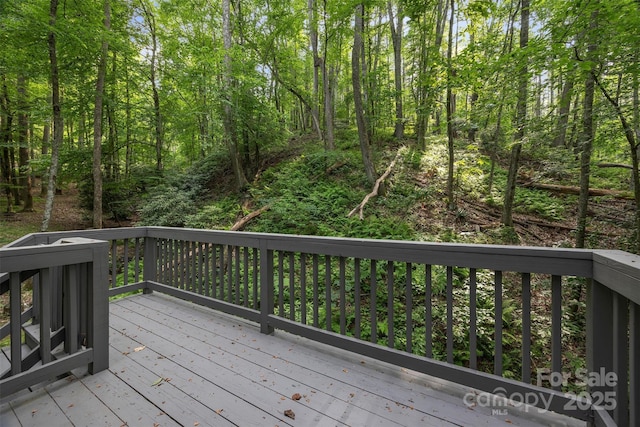189 Woodstock Dr, West Jefferson, NC 28694 - deck featuring a wooded view
