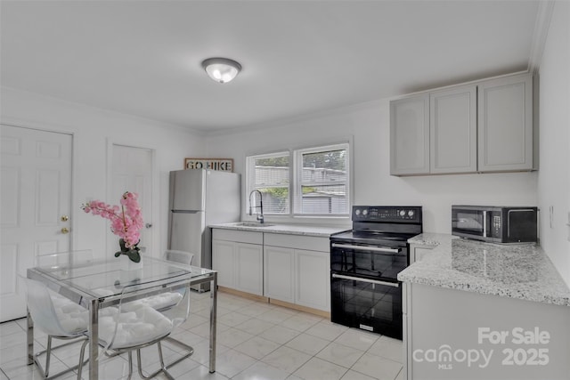 123 E Farmview St, Gastonia, NC 28054 - kitchen featuring black appliances, crown molding, light stone counters, and light tile patterned floors