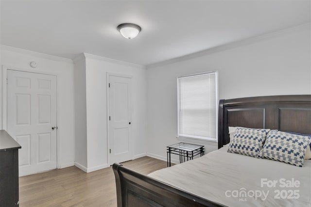 123 E Farmview St, Gastonia, NC 28054 - bedroom with crown molding, light wood finished floors, and a closet