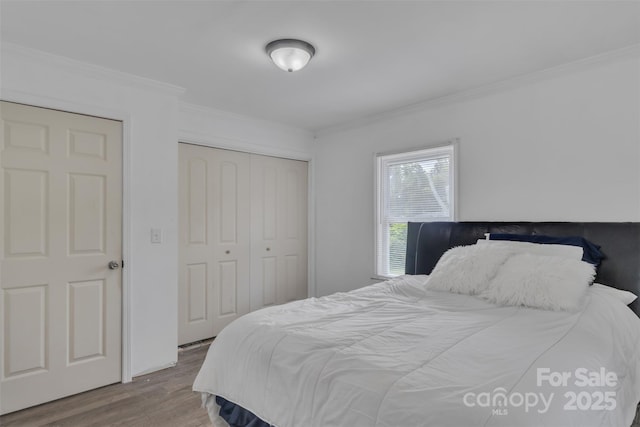 123 E Farmview St, Gastonia, NC 28054 - bedroom featuring ornamental molding, wood finished floors, and a closet
