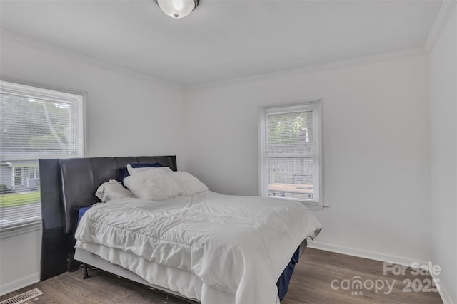 123 E Farmview St, Gastonia, NC 28054 - bedroom with crown molding and dark wood-style flooring